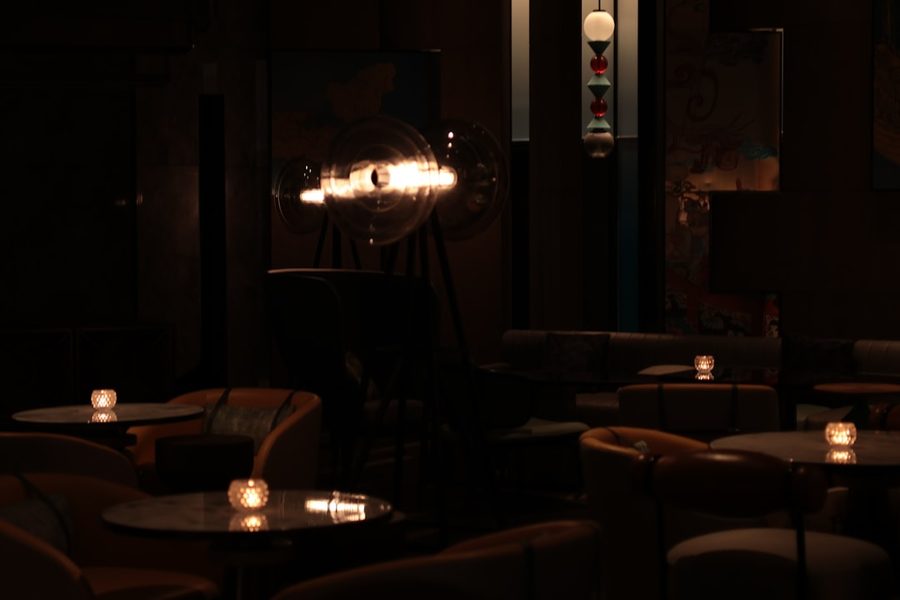 Candle-lit private lounge set for an intimate casino-themed party